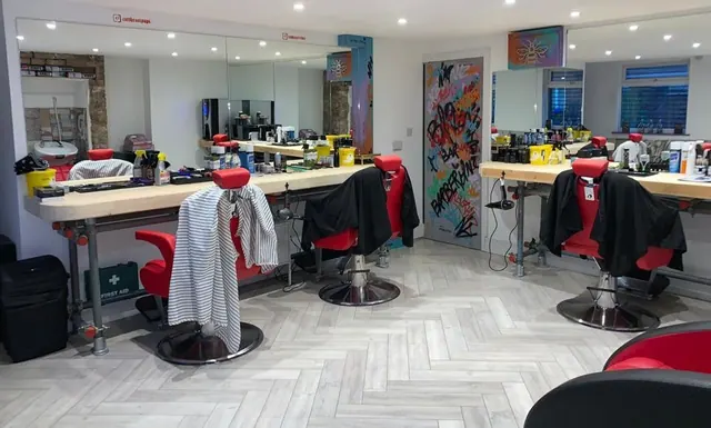 Inside Barberianz: the chairs and graffiti wall