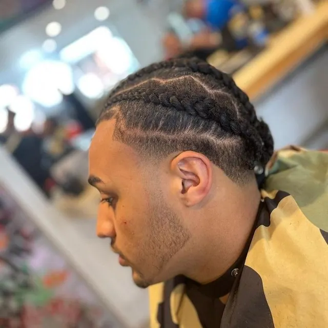 Braids and a fade at Barberianz